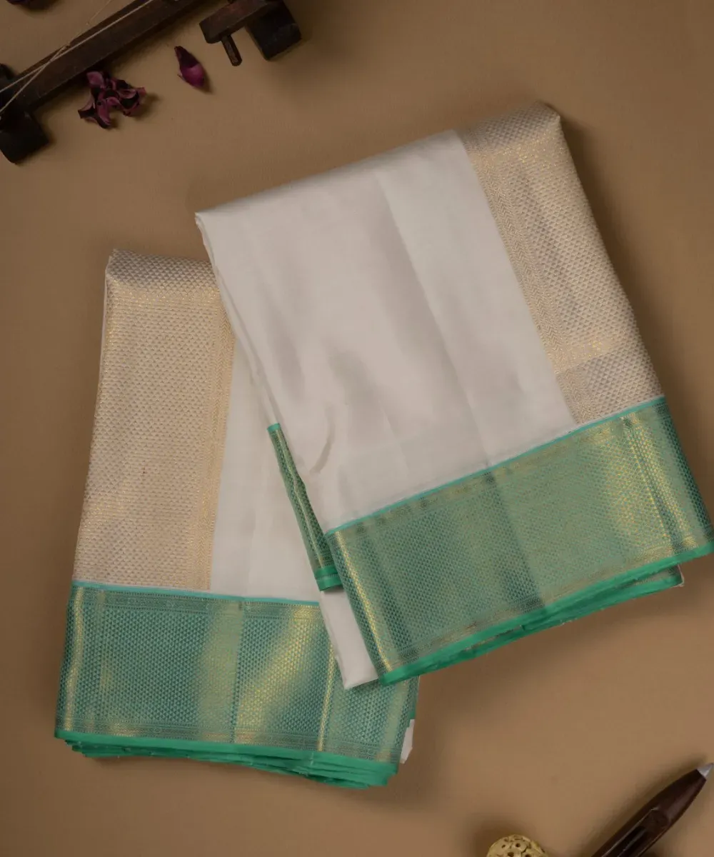 White Silk Dhoti with Light Teal Border – Kira Handlooms